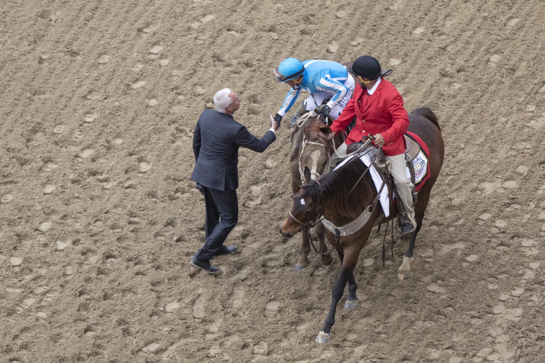 Todd Pletcher, trainer of scratched Kentucky Derby favorite Forte and two Derby also-rans, congratulates Javier Castellano after the jockey's win aboard Mage.