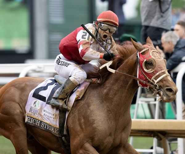 Sonny Leon reacts as Rich Strike wins the Kentucky Derby at Churchill Downs