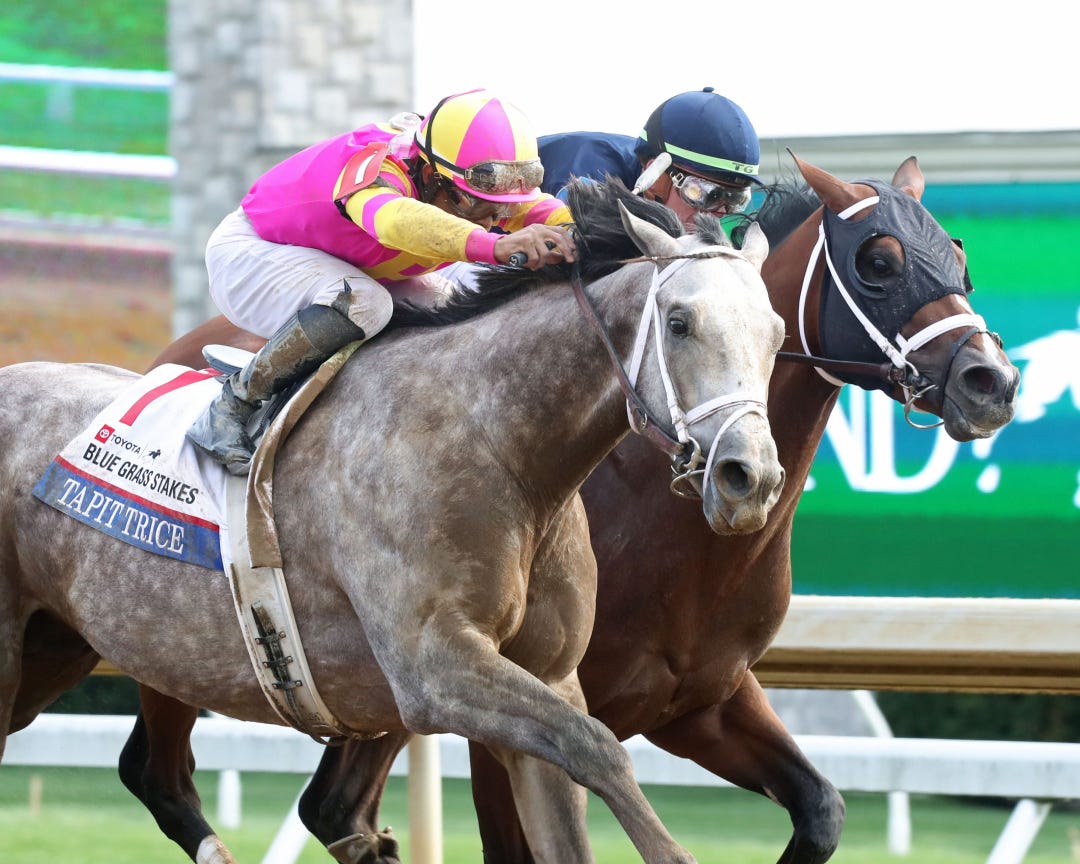 Tapit Trice and jockey Luis Saez edge past Verifying and Tyler Gaffalione at the wire in the Blue Grass Stakes on Saturday at Keeneland.