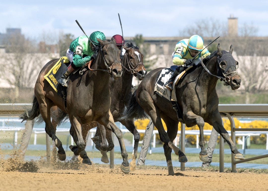Shidabhuti (left) overtakes Ain't Broke to win Distaff at AQU April 6 2024